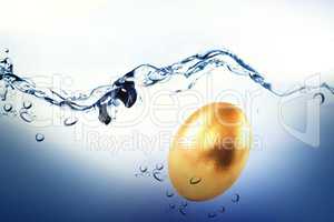 Composite image of golden easter egg on white background