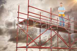 Composite image of portrait of happy repairman standing arms crossed