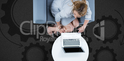 Composite image of woman on her laptop