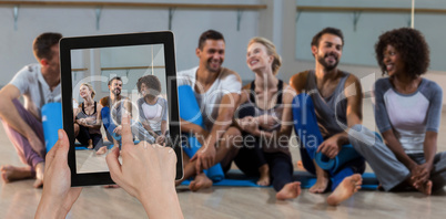 Composite image of hands touching digital tablet against white background