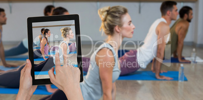 Composite image of hands touching digital tablet against white background