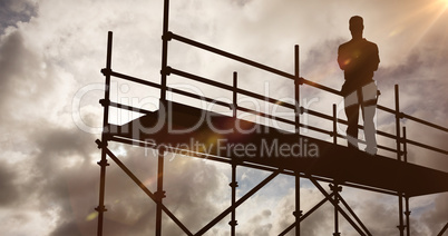 Composite image of portrait of happy repairman standing arms crossed