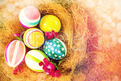 Painted Easter eggs in nest