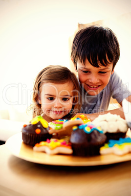 Brother and sister looking at confectionery