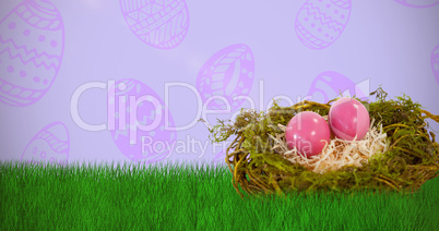 Composite image of pink easter eggs on artificial nest