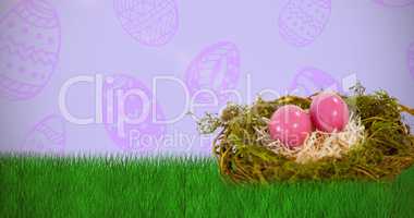 Composite image of pink easter eggs on artificial nest