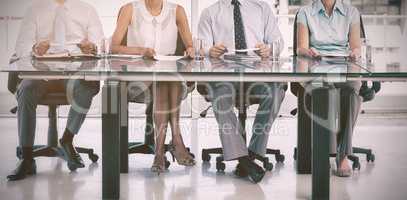 Group of business people sitting at table