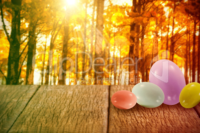 Composite image of big and small multi colored easter eggs