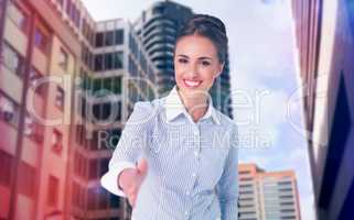 Composite image of smiling businesswoman offering handshake