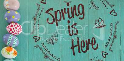 Composite image of spring is here logo against background