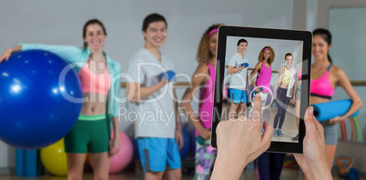 Composite image of hands touching digital tablet against white background