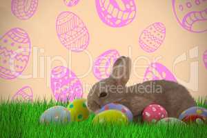 Composite image of brown bunny with colorful easter egg