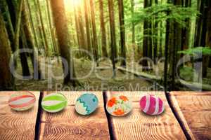 Composite image of colorful easter eggs arranged side by side