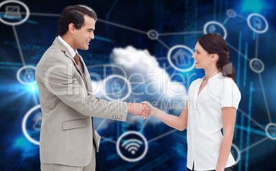 Composite image of happy business partners shaking hands