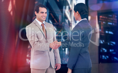 Composite image of happy corporate man doing handshake