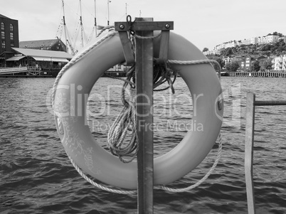 Life buoy by the river in black and white