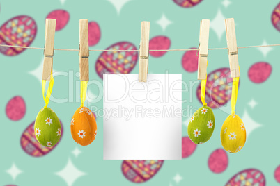 Composite image of hanging easter eggs