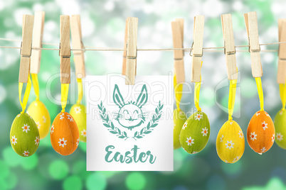 Composite image of hanging easter eggs