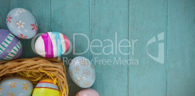 Various Easter eggs arranged in wicker basket