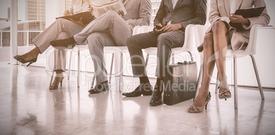 Business people sitting in waiting room