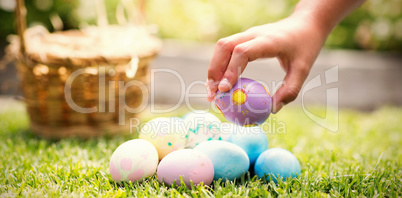 Little girl collecting easter eggs