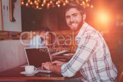 young man working on his computer