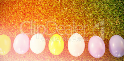 Colored Easter eggs on grass