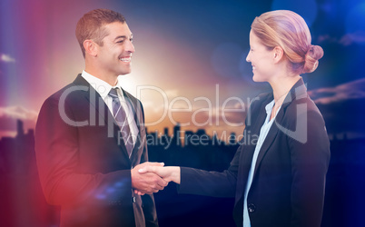 Composite image of happy partners shaking hands