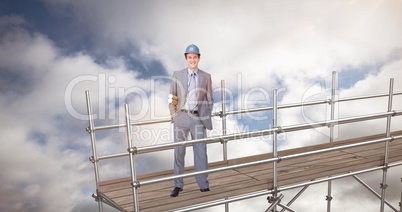 Composite image of smiling attractive architect on phone holding plans