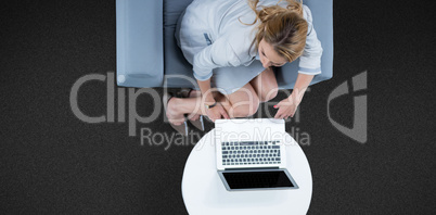 Composite image of woman on her laptop