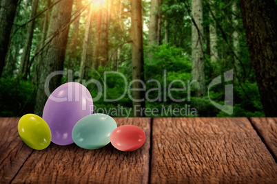 Composite image of big and small multi colored easter eggs
