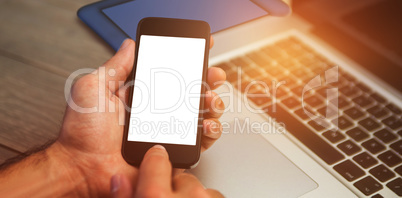 Cropped image of person using mobile phone