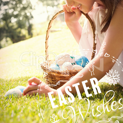 Composite image of little girl collecting easter eggs