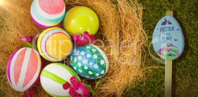 Composite image of easter egg hunt sign