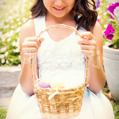 Happy girl collecting easter eggs