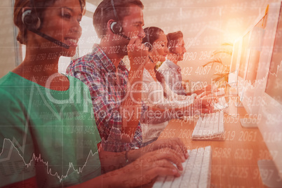 Composite image of business team working at the call centre