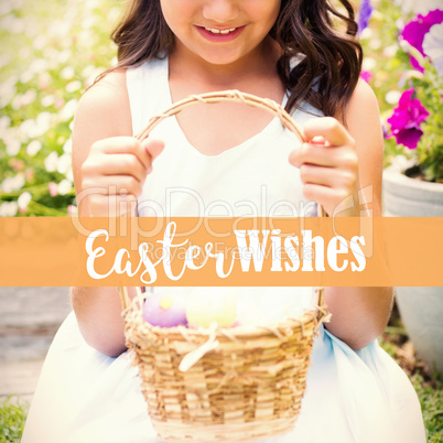 Composite image of happy girl collecting easter eggs