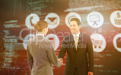 Composite image of smiling businessman shaking hands with colleague