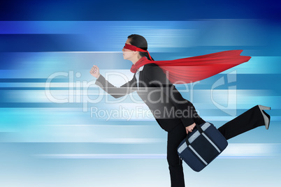 Composite image of businesswoman running while pretending to be super hero