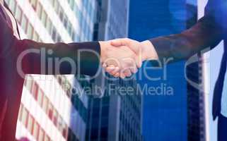 Composite image of businessman shaking hands with colleague