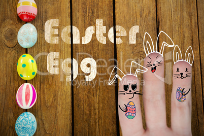 Composite image of vector image of fingers representing easter bunny