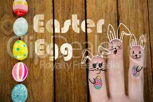 Composite image of vector image of fingers representing easter bunny