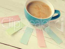 Cup of coffee with sticky notes