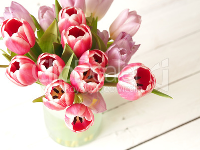 Bunch of tulips on wood