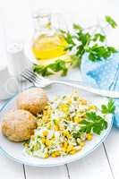 Vegetable cabbage salad and meatballs on plate close up, white background