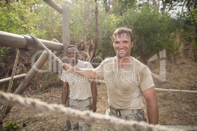 Portrait of military soldiers smiling during obstacle training