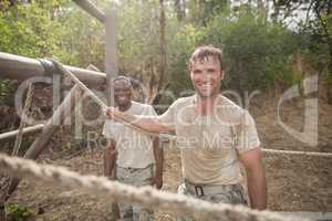 Portrait of military soldiers smiling during obstacle training