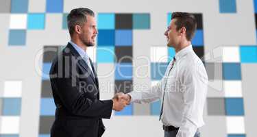 Composite image of smiling businessmen shaking hands