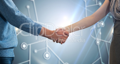 Composite image of partners shaking hands