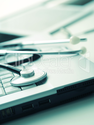 Medical utensils on a laptop